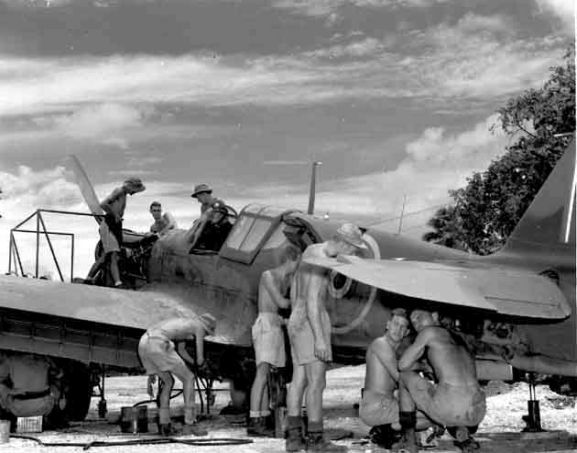 pr2051 copy_web Group of Servicing Unit personnel performing maintenance on a Curtiss P-40 Kittyhawk at Ondonga, New Georgia, 1943. Image ref PR2051 ©RNZAF Official.