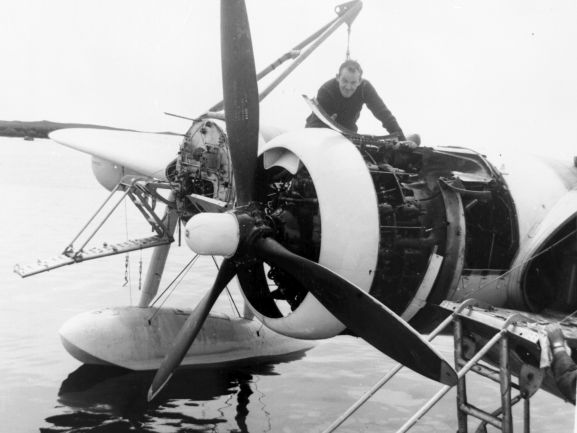 PR2183-R1-1-59 Salvage of Maritime Operational Conversion Unit Sunderland, NZ4111, after it was holed and sank in Te Whanga Lagoon, Chatham Islands. Unknown serviceman working to remove the inner starboard engine.