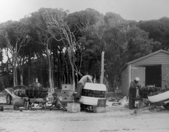 PR2183-R1-16-59 Salvage of Maritime Operational Conversion Unit Sunderland, NZ4111, after it was holed and sank in Te Whanga Lagoon, Chatham Islands. Members of the salvage party stripping the engines for return to New Zealand.