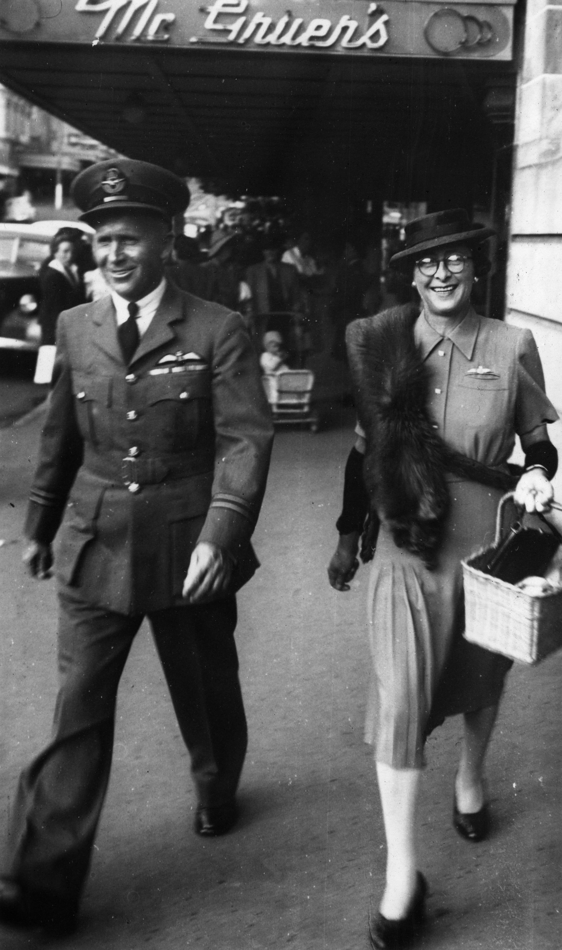 1981-332.8 Flight Lieutenant HC Leese and his wife walking in a street in New Plymouth.