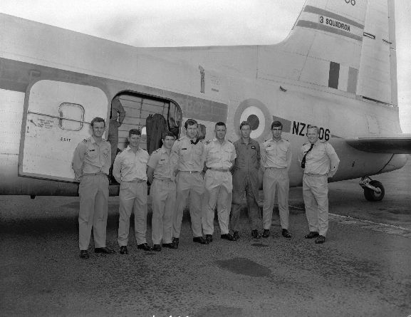 OhG2655-70 Group of No. 75 Squadron officers pose beside No. 3 Squadron Bristol Freighter NZ5906, before leaving for the USA to convert to Skyhawks. RNZAF Base Ohakea. L-R: Fred (Graeme) Thompson, John Scrimshaw, Ken Cox, Murray Abel, Laurie Lawless (Navigator & Admin), Trevor Bland, Mike Callanan, Ross Ewing. People missing are Roger Henstock, Ken Gayfer, John Woolford. All names supplied by Squadron Leader Jim Jennings, 2004.