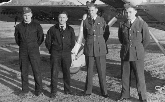 Air Force Museum of New Zealand Group standing in front of Vildebeest NZ102 at Rongotai aerodrome during the Air Pageant. L-R: unknown (Rigger), Aircraftman 1 Tucker (Fitter), Pilot Officer LH Trent, Acting Pilot Officer Rankin.