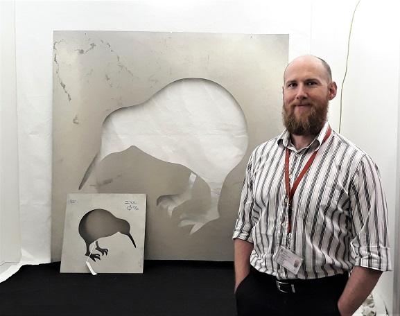 20200814_133403 Collections Technician Murray McGuigan with the original stencils for the application of the RNZAF kiwi roundel, now in the collection of the Air Force Museum of New Zealand.