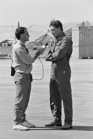 PD19-22-91 No. 40 Squadron pilot, Flight Lieutenant DG Wake, being interviewed by a Radio News reporter at Al Qaisumah Airport, Saudi Arabia. Feb-Mar 1991. Image ref PD19-22-91, RNZAF Official.
