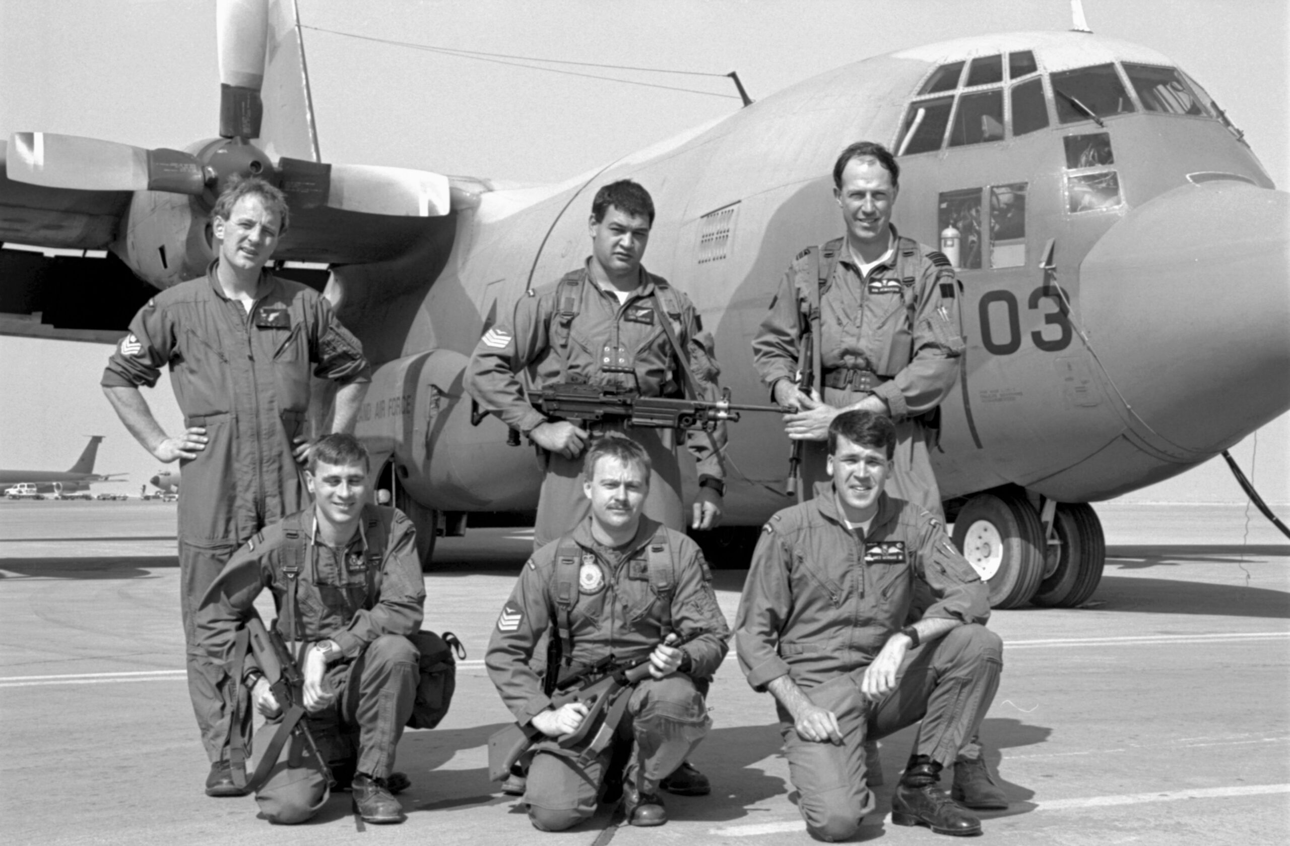 PD21-21-91 Crew of No. 40 Squadron Hercules NZ7003. Presumed to be at Riyadh, Saudi Arabia, 1991.
L-R: Back; Flight Sergeant Bruce Melvin, Sergeant J Buchler, Wing Commander Robert Henderson (Detachment Commander and aircraft captain)
Front; Flying Officer Kevin McEvoy, Sergeant Ty Cochran, Flying Officer M Morgan. Image ref PD21-21-91, RNZAF Official.