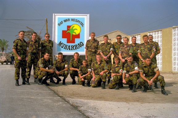 PD30-12-91 Group of New Zealand Defence Force Medical Contingent personnel, in front of a sign
