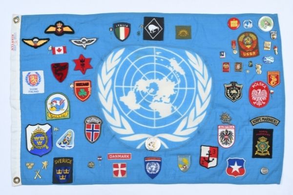New to the collection web United Nations flag with badges and patches